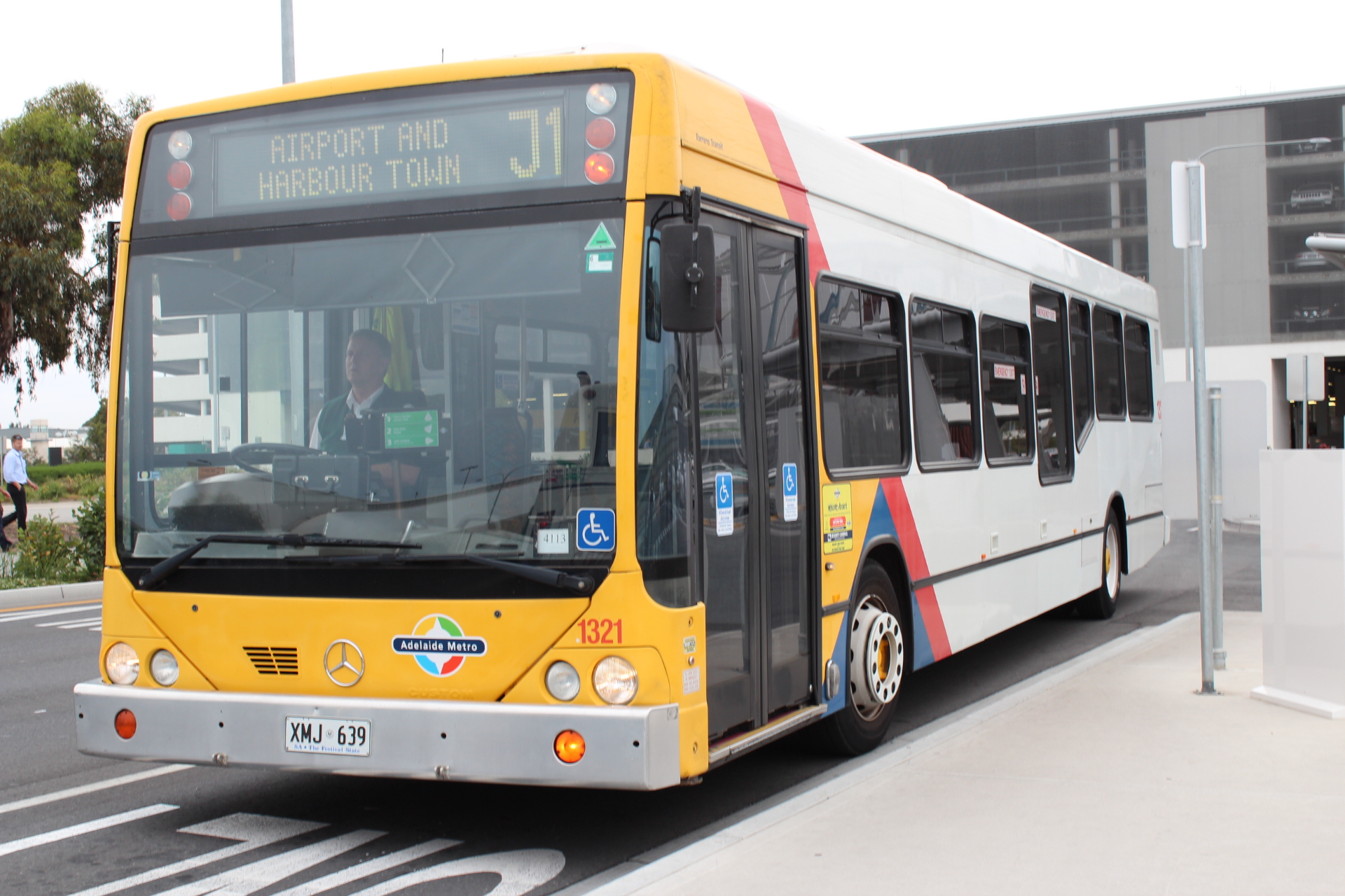 An Adelaide Metro bus on the J1 route to Glenelg at Adelaide Airport, photographed in 2014