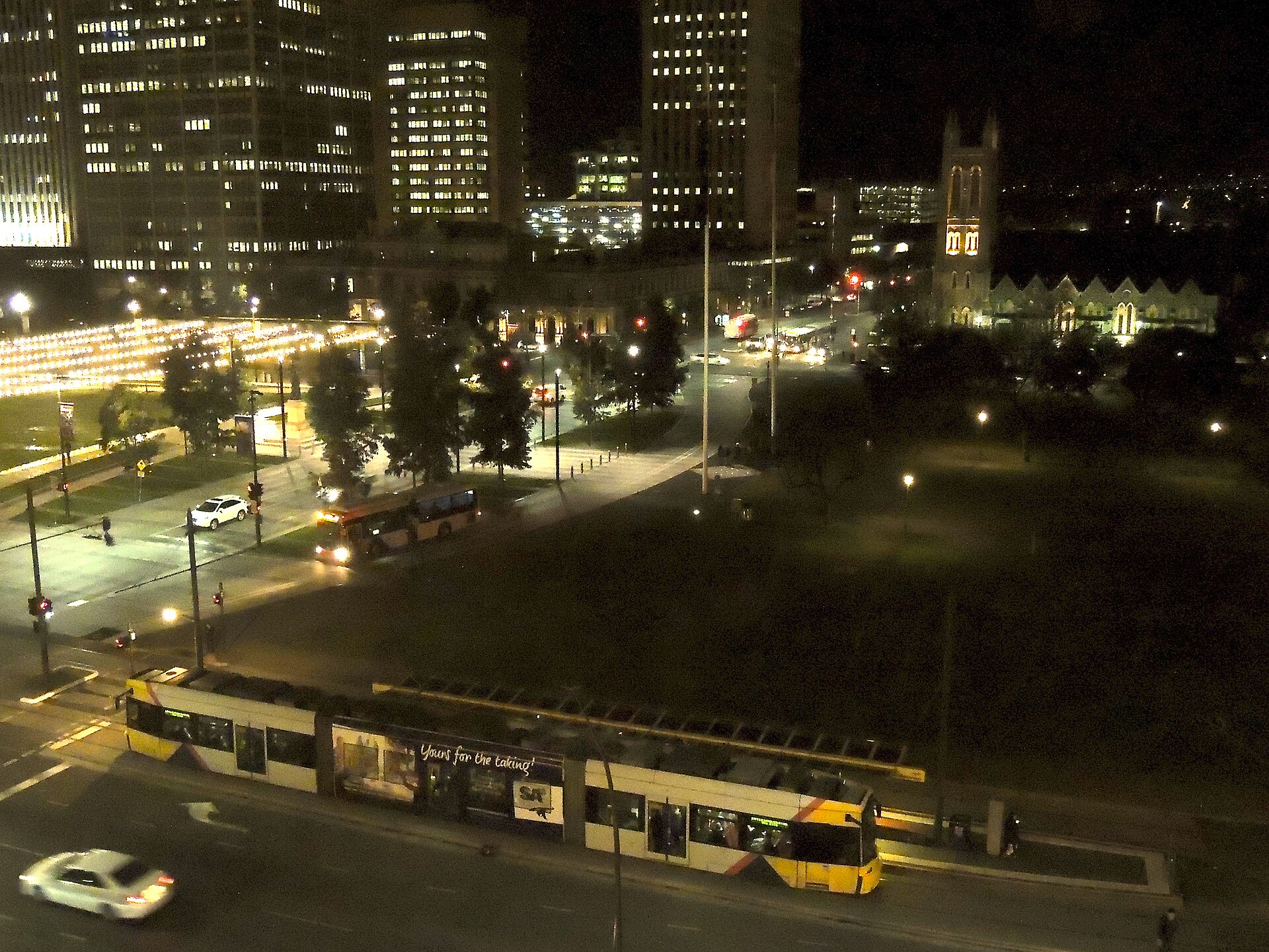 A tram and a bus at Victoria Square, Adelaide, photographed in 2017