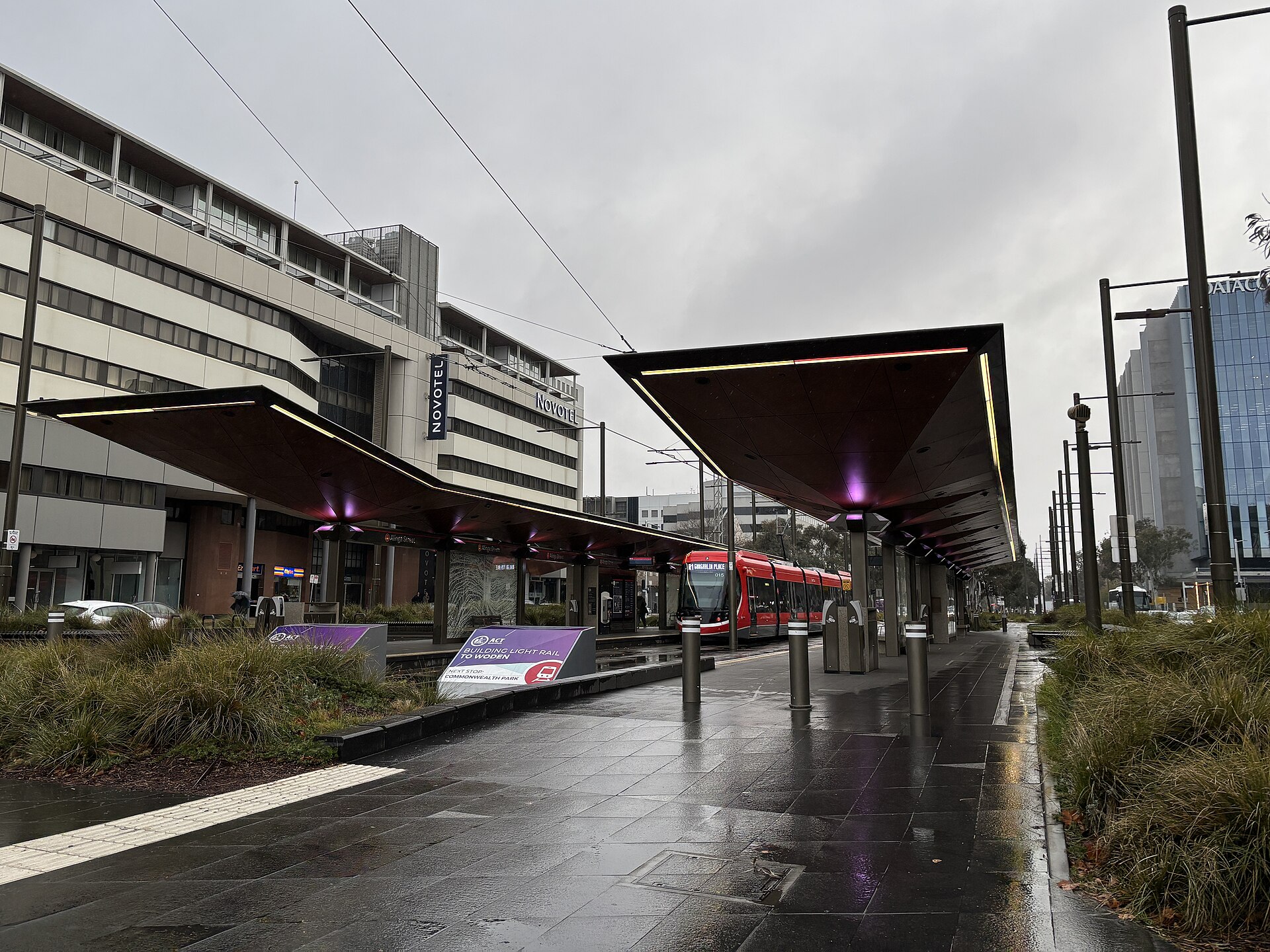 The Alinga Street light rail stop on a wet day in June 2025