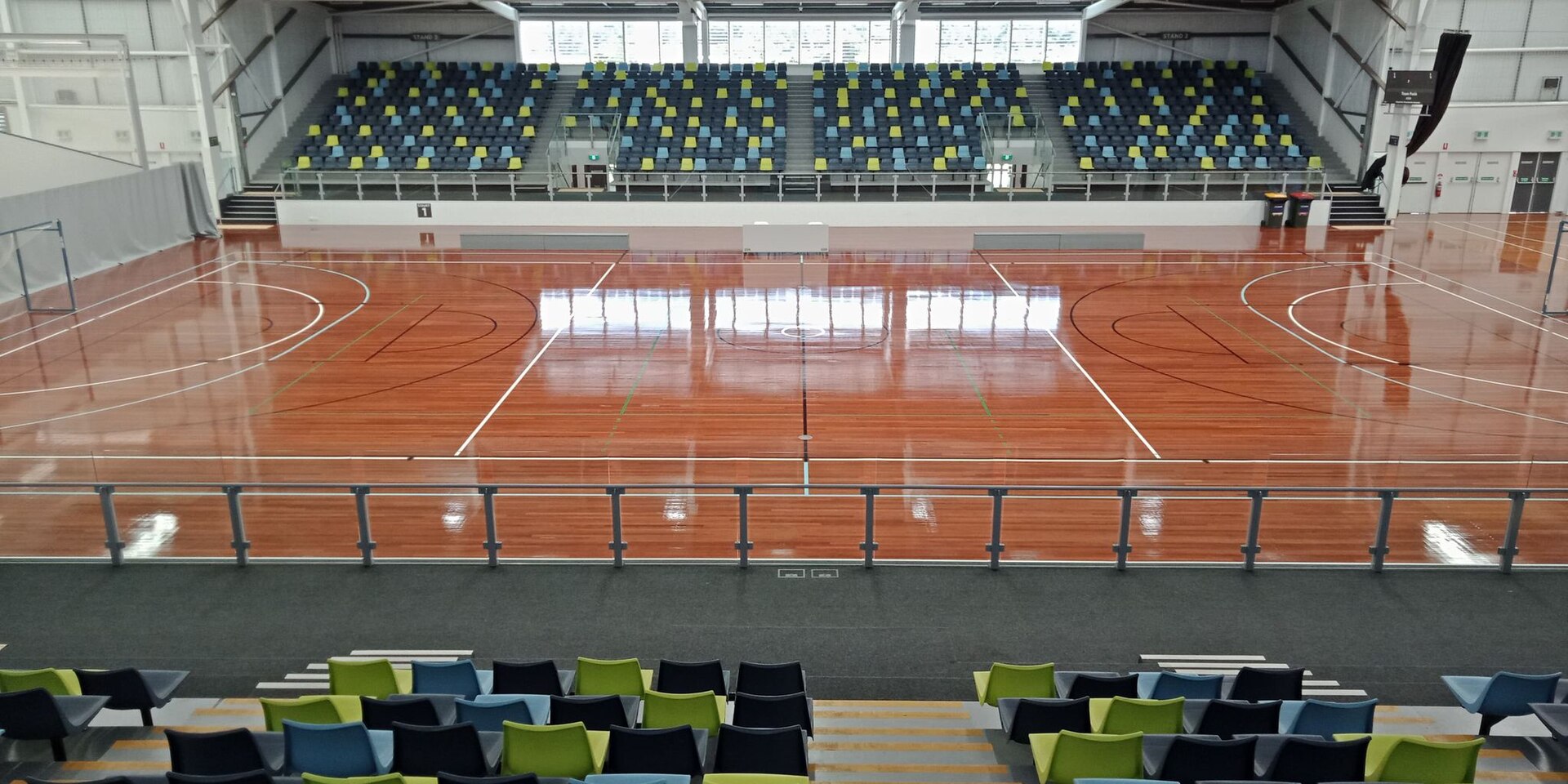 Inside the Carrara Indoor Stadium; People First Stadium puts its accessible drop-off in the Red Car Park behind the indoor sports stadium