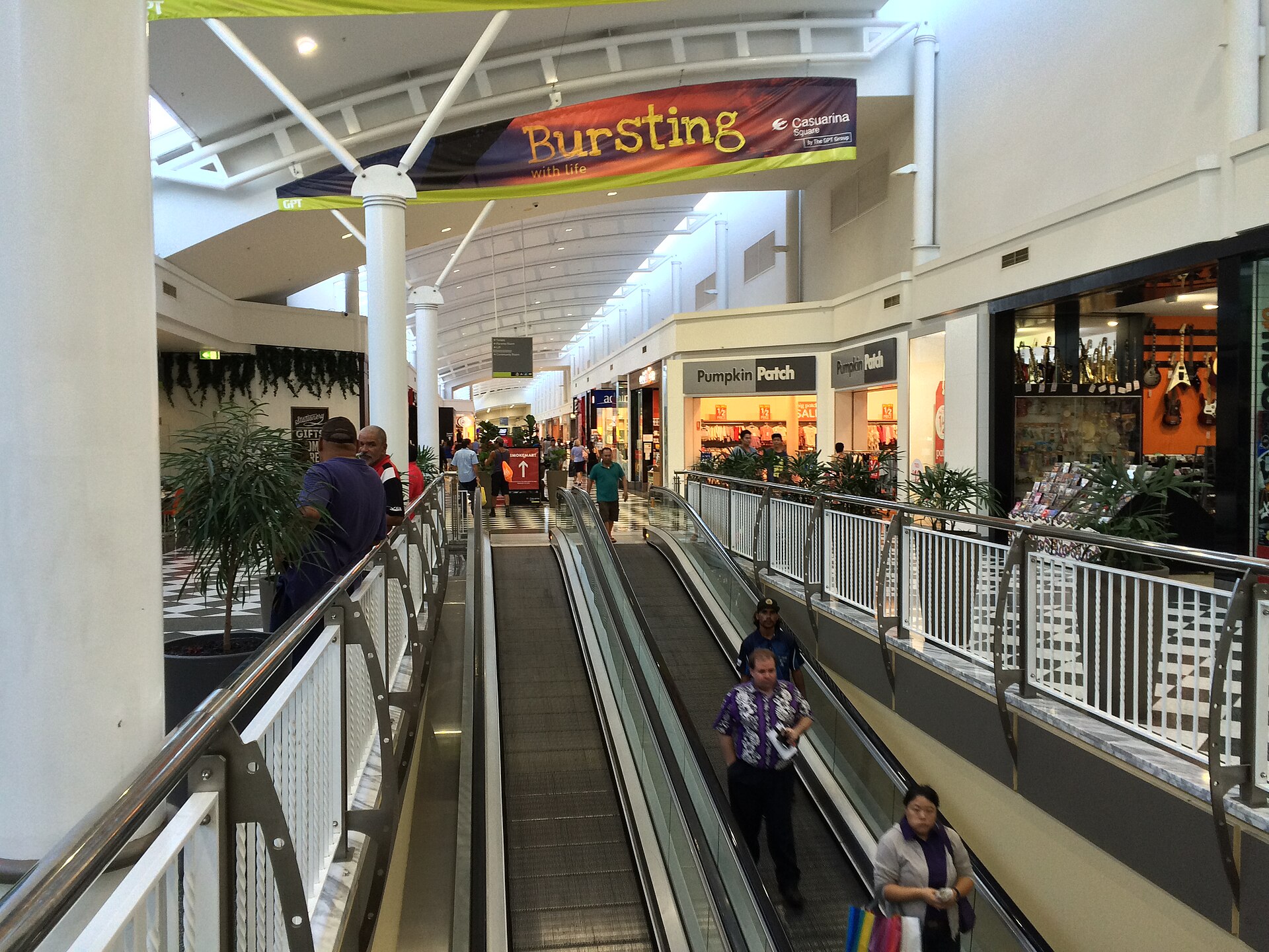 Escalators and shopfronts inside Casuarina Square, Darwin, photographed in June 2016