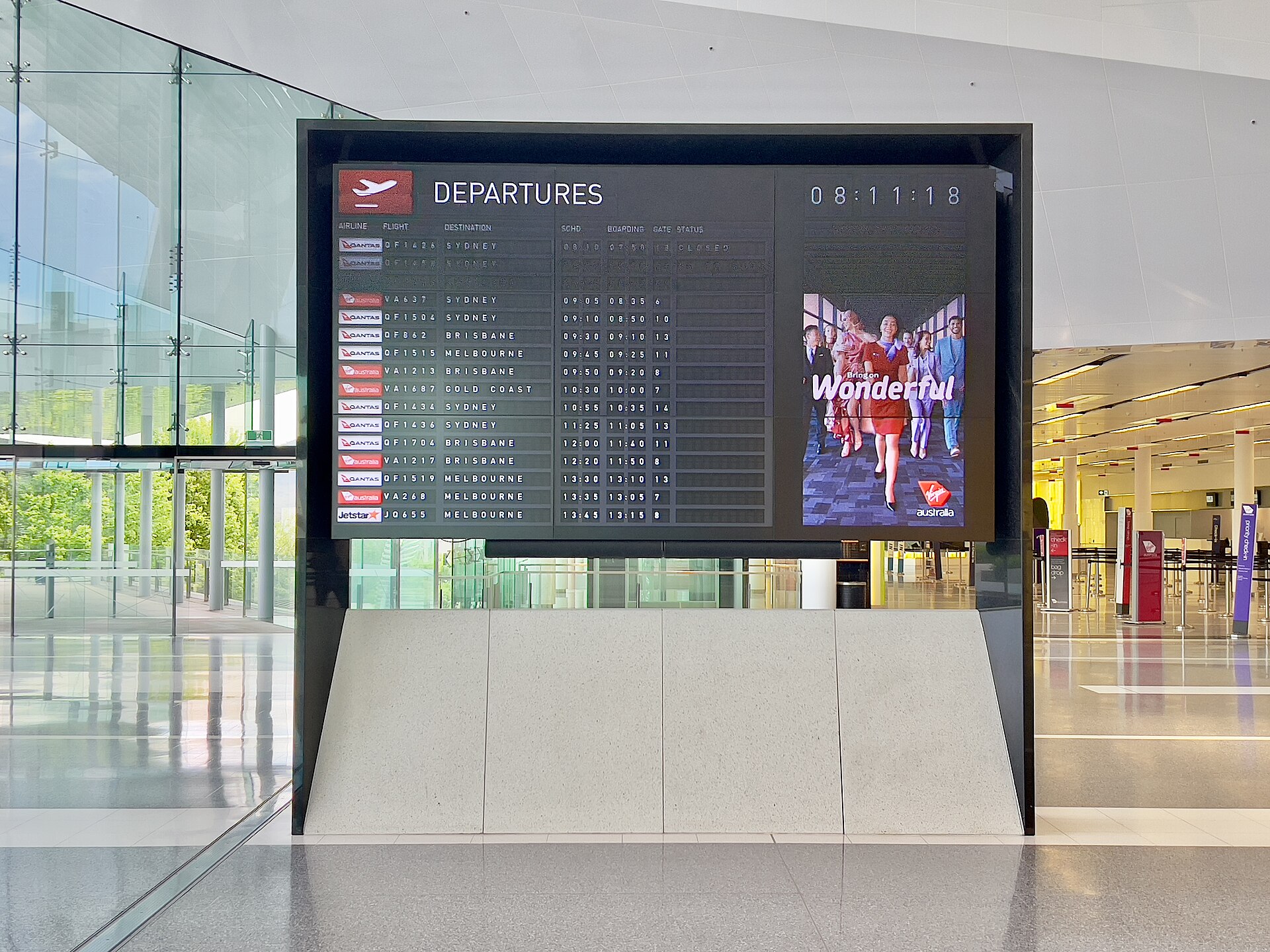 A flight departure board at Canberra Airport in November 2022