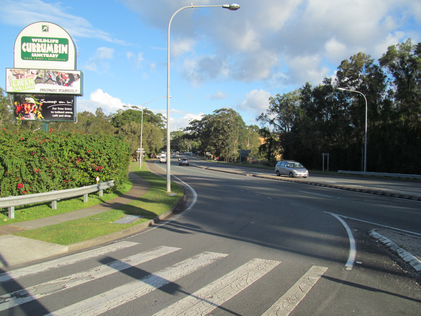 Gold Coast Highway looking south from near Currumbin Wildlife Sanctuary, with the sanctuary sign (photo taken in 2013)