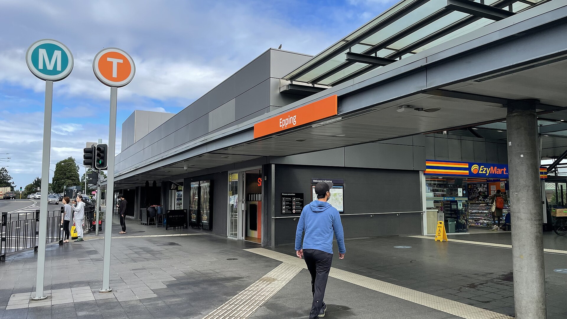 Epping Station entrance on Langston Place with a Metro M sign and a Trains T sign