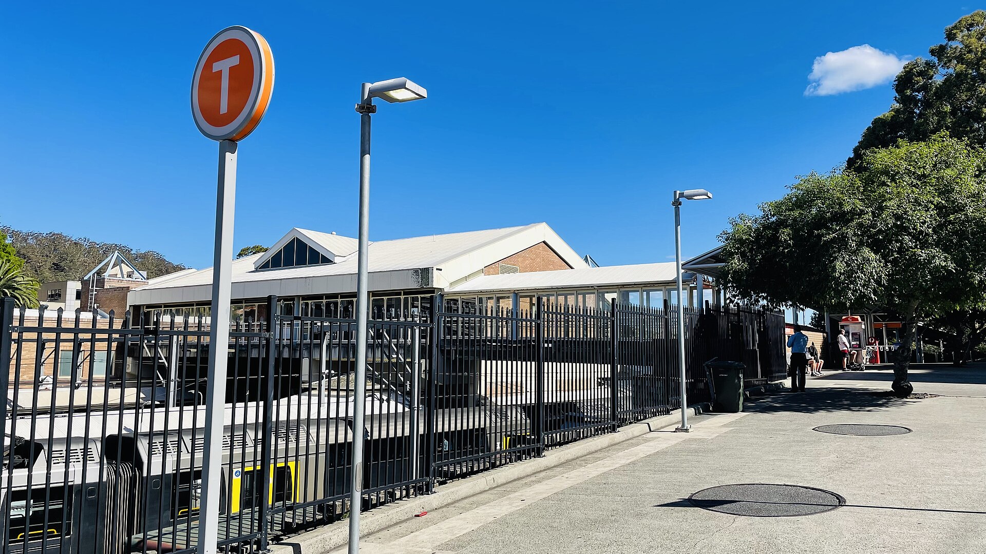 The Gosford Railway Station entrance on Showground Road, with a Transport T sign