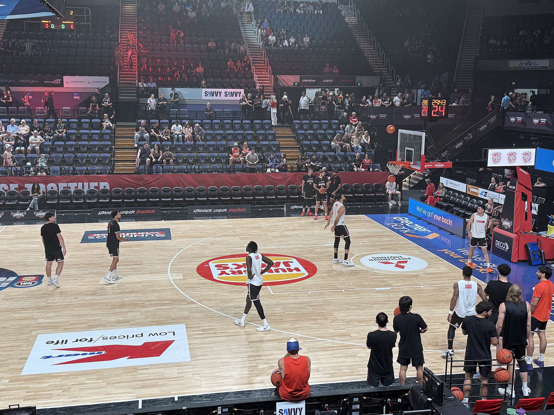 Illawarra Hawks players warming up before a December 2025 NBL game at WIN Entertainment Centre