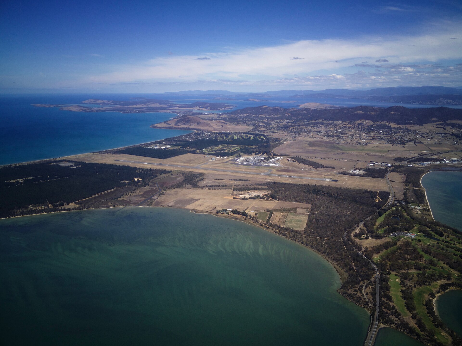 Hobart Airport seen from above, with the terminal and runway