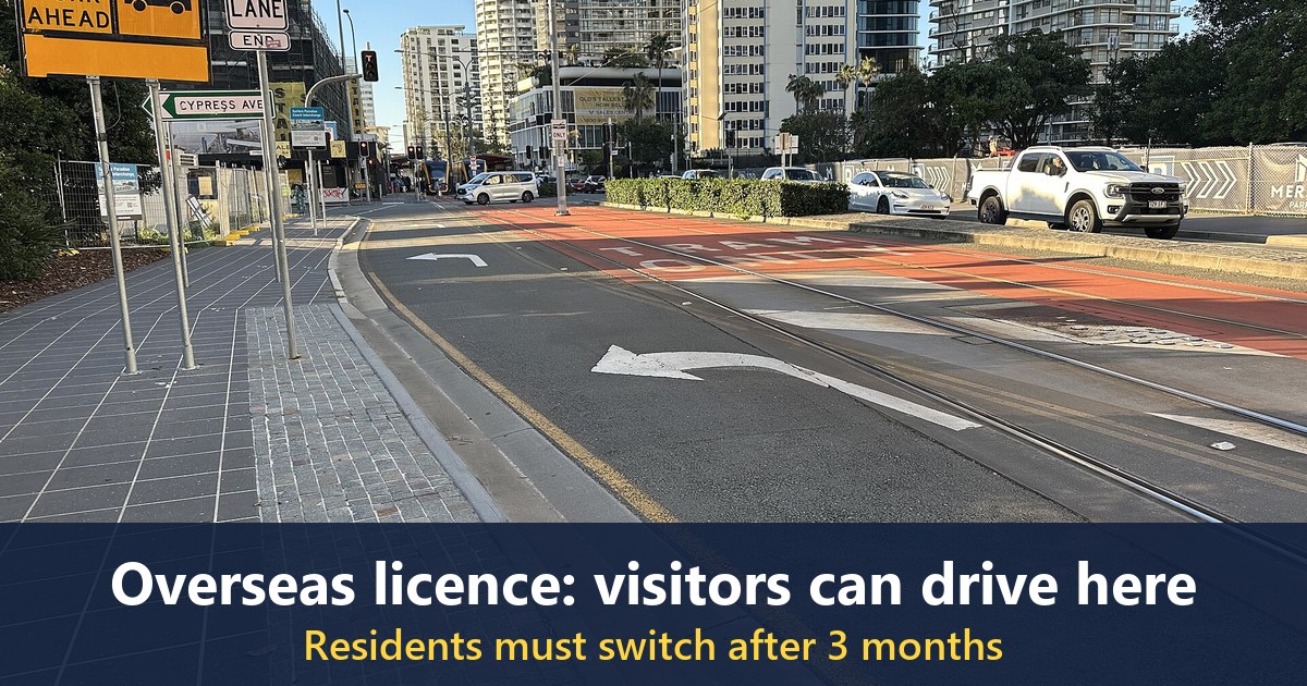 Surfers Paradise Boulevard near Cypress Avenue in June 2026, with a left-turn arrow marked on the road and a red tram-only lane