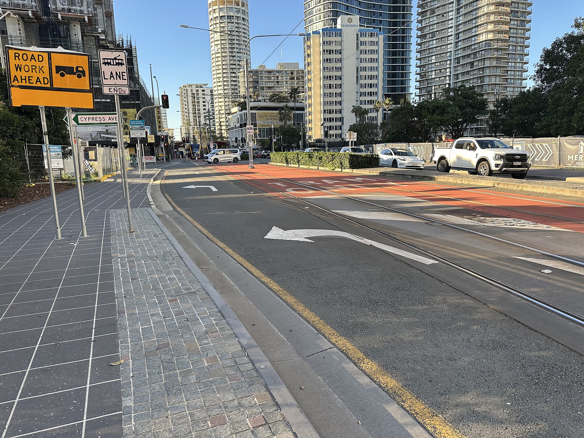 Surfers Paradise Boulevard near Cypress Avenue, June 2026, with a left-turn arrow marked on the road and road-work signs