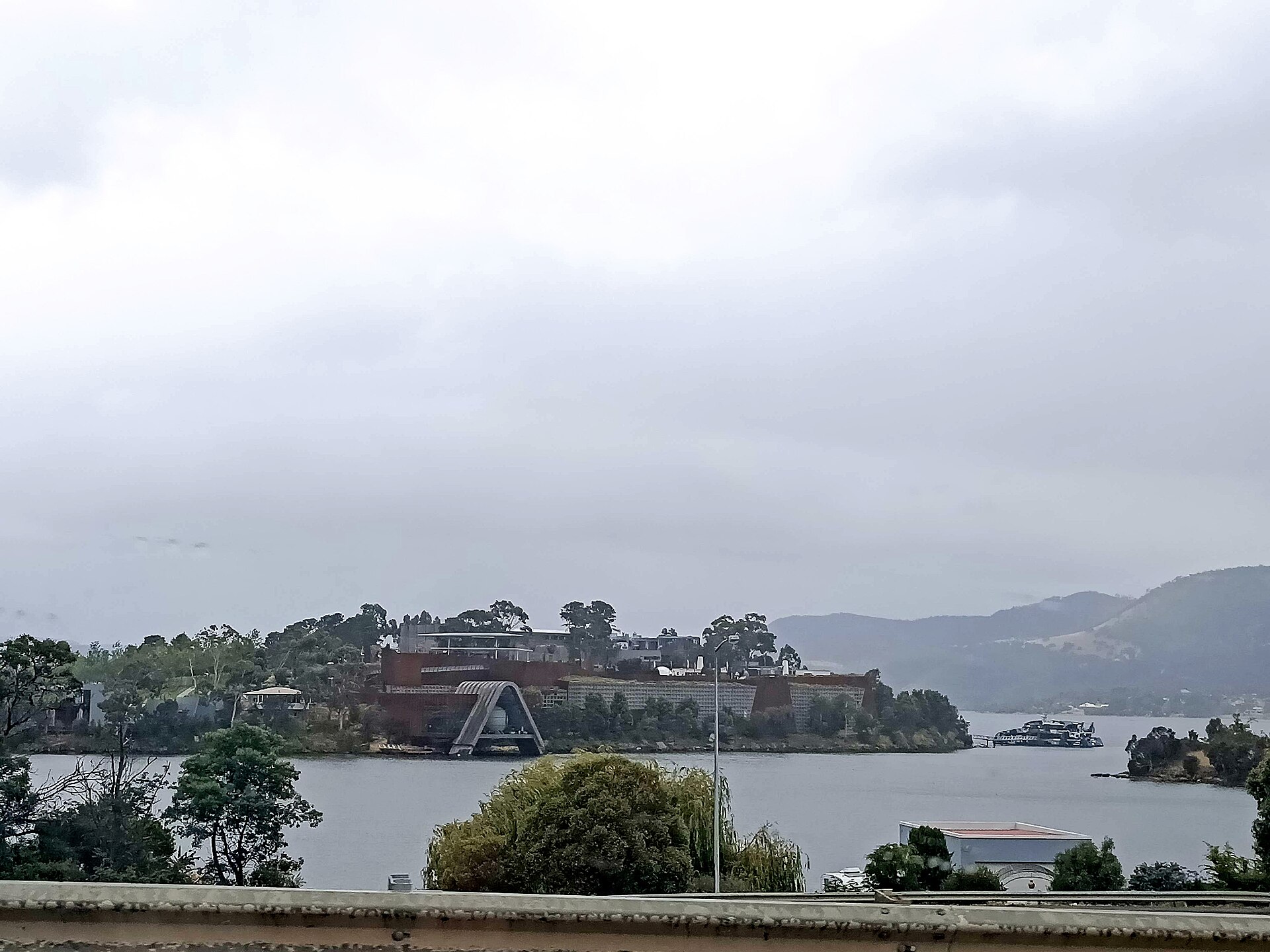 Mona on its headland on the River Derwent, seen from across the water on an overcast day
