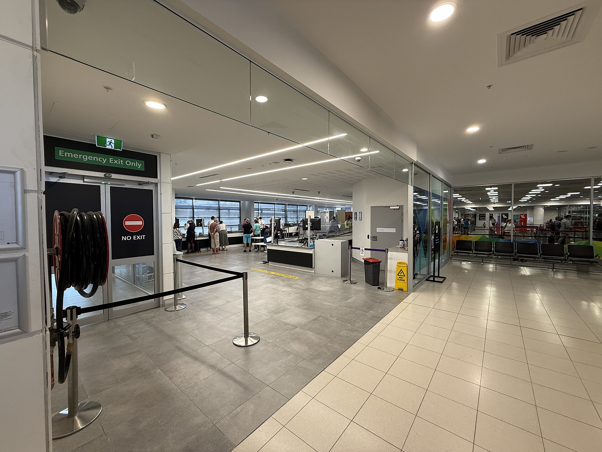 Inside Newcastle Airport near a security screening area, photographed in December 2025