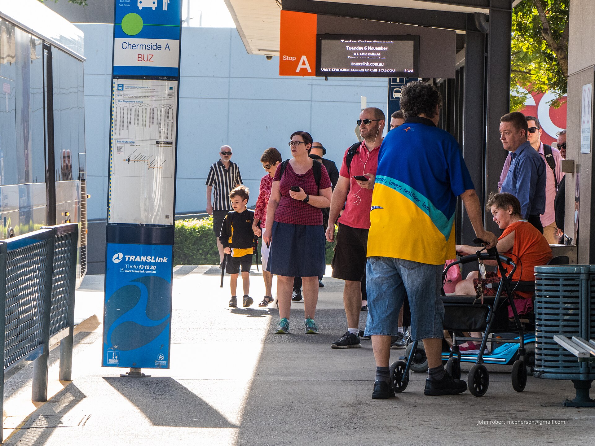 Passengers boarding at the A stop of the Chermside Bus Interchange, photographed in 2018