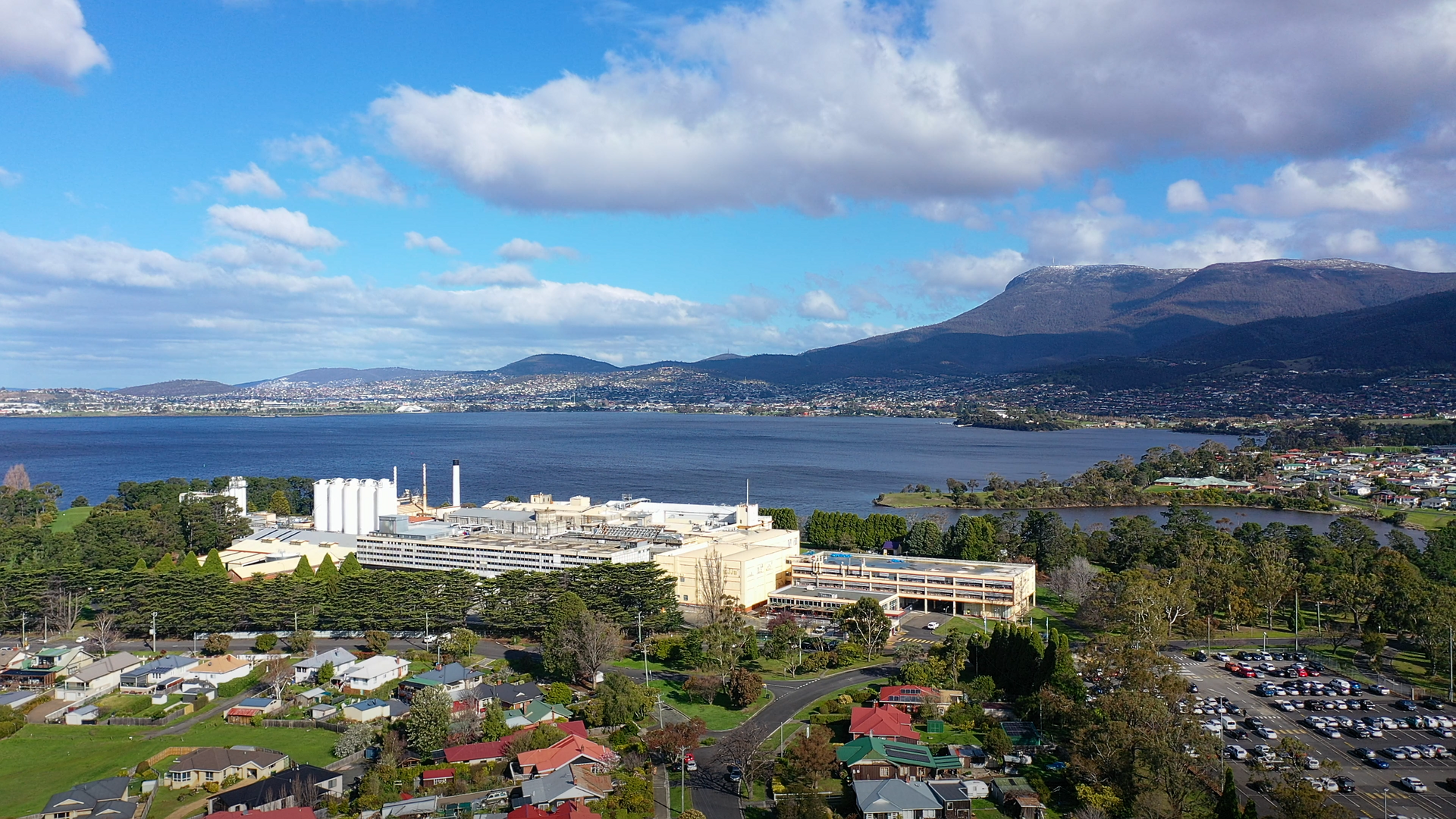 An aerial view of Claremont, Tasmania, looking across the River Derwent towards Hobart and kunanyi/Mount Wellington