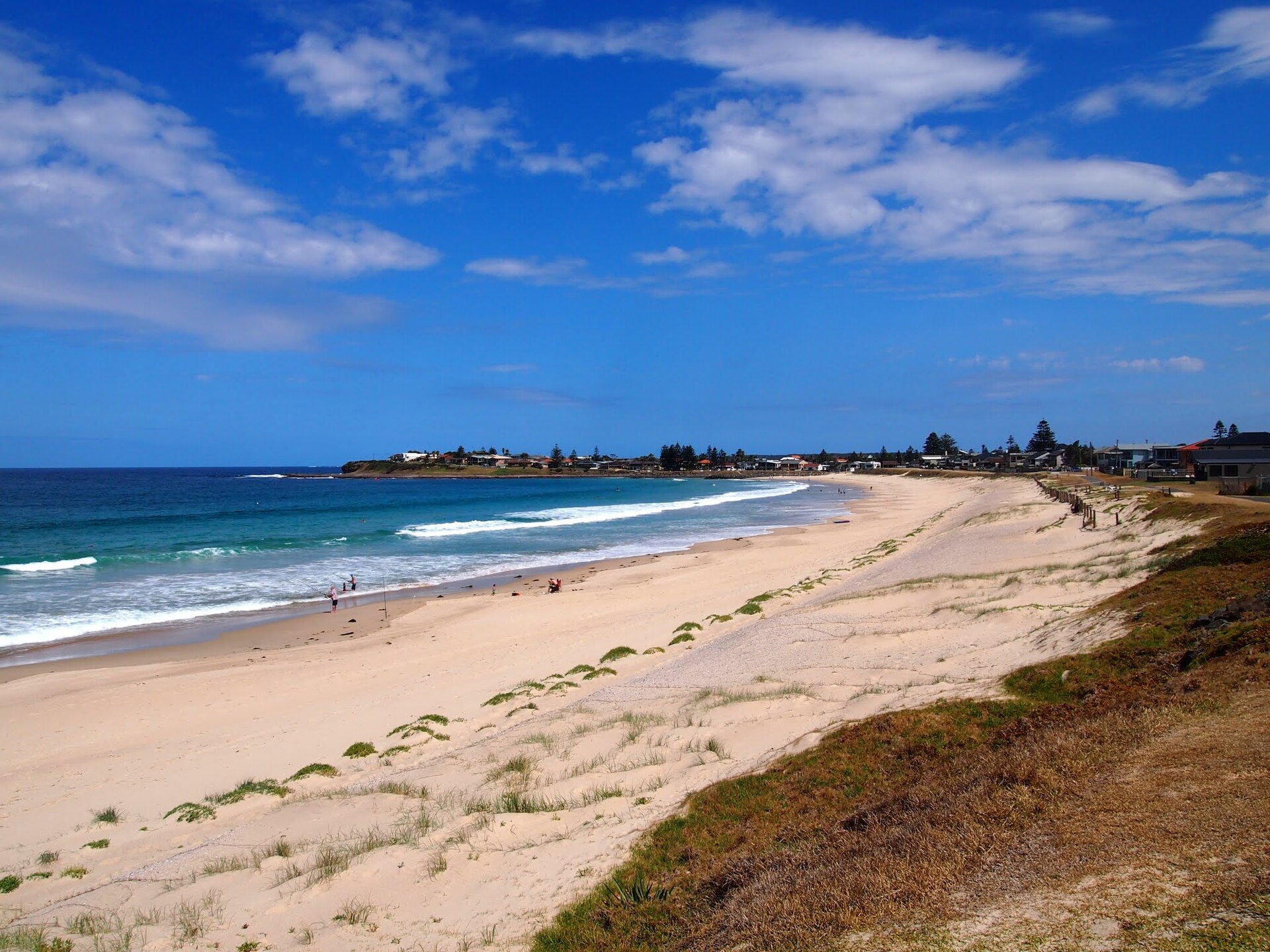 Warilla Beach, NSW, with waves breaking along the sand