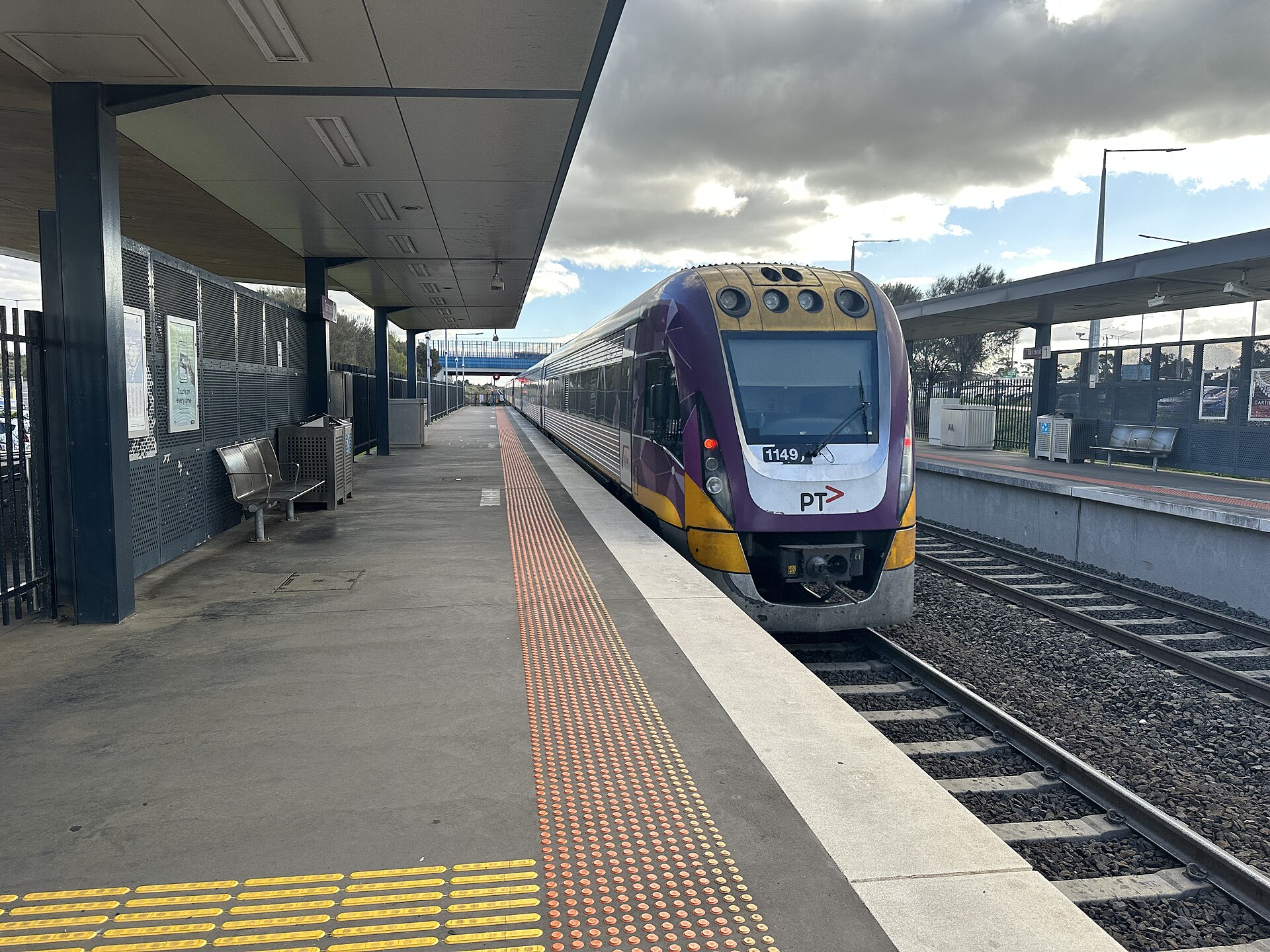 A V/Line service to Geelong departing Tarneit station in July 2026